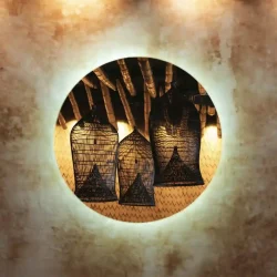 Backlit mirror reflecting artisanal rattan lanterns in our dining room backlit circular mirror reflecting handcrafted rattan lanterns at Billy Ho modern Japanese restaurant in Canggu